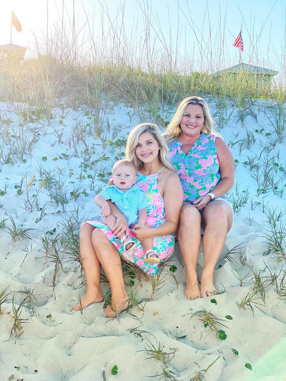 Langston Kinlaw, held by mother Breanna Kinlaw, and Brandy Gillis (right)