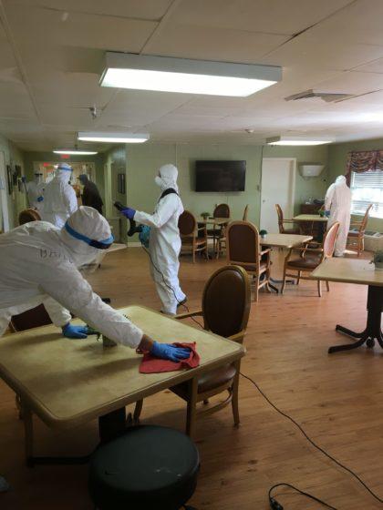 National Guard members disinfect a room at a Dawson nursing home owned by Rollins, after a COVID-19 outbreak.