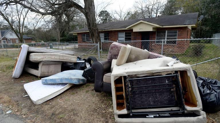 Furniture and other belongings sit at the curb after the Magistrate Court Sheriff’s office supervised a court ordered eviction on Del Park in late January 2019. 