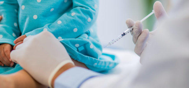 Child receiving vaccine.