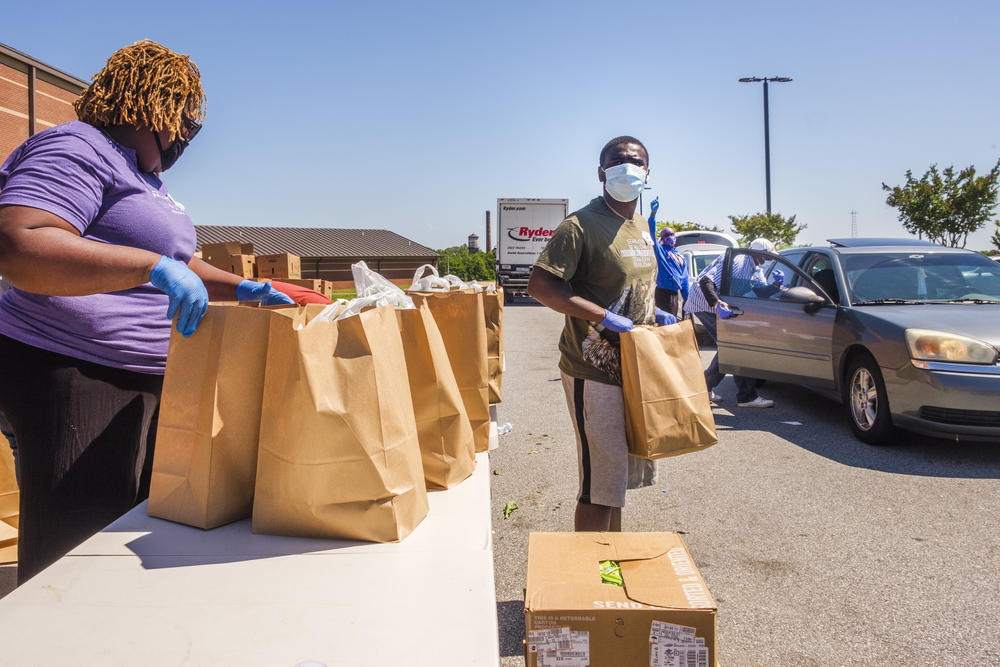 Volunteers in Macon hand out food