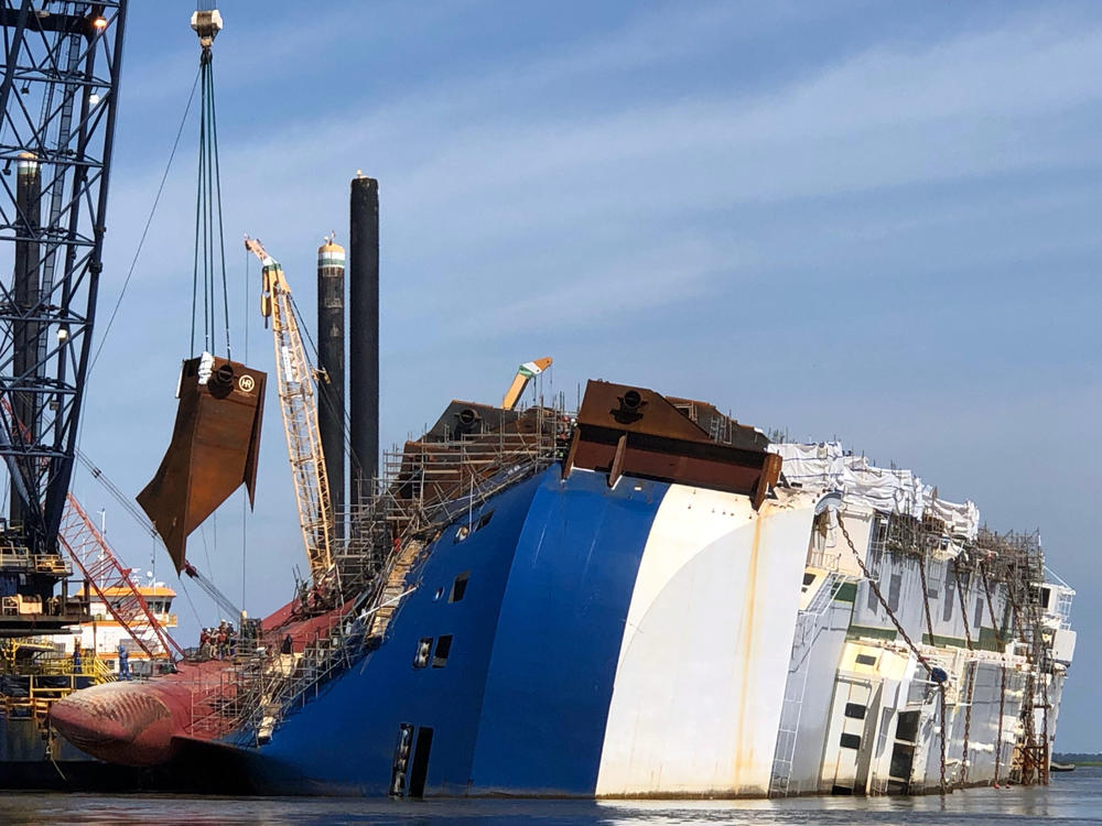 A crane positions the 16th and final lifting lug onto the hull of the motor vessel Golden Ray in St. Simons Sound, Georgia, June 3, 2020. 