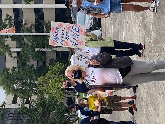 Woman holds sign at Macon vigil honoring Ruth Bader Ginsburg