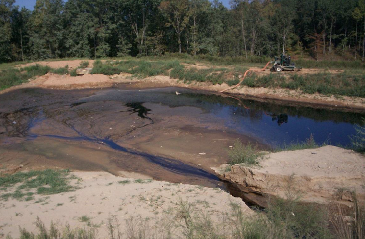 Leachate flowing from split in the Pine Bluff Landfill.