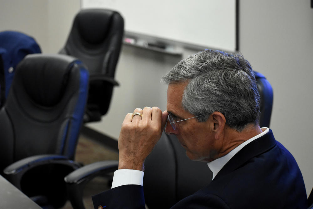 Georgia Republican Secretary of State Brad Raffensperger listens to staff detail voting precincts open past 7 p.m. because of problems on June 9, 2020.