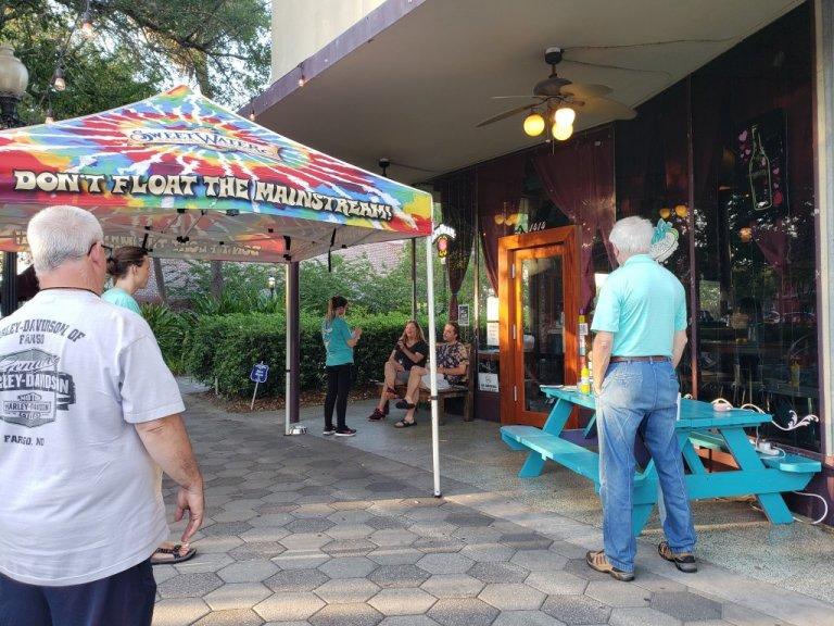 Vacationers heading to the Georgia coast for the Labor Day holiday will be at less risk of a COVID-19 infection at the beach than when they visit a local bar or restaurant. Tipsy McSway's in Brunswick, shown in late April, is now sometimes open for live music with limited seating.