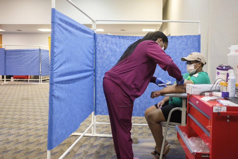 Nikeira Hall gives a blood sample as a part of the Augusta University coronavirus antibody study in Dougherty County at the Albany Civic Center recently. 