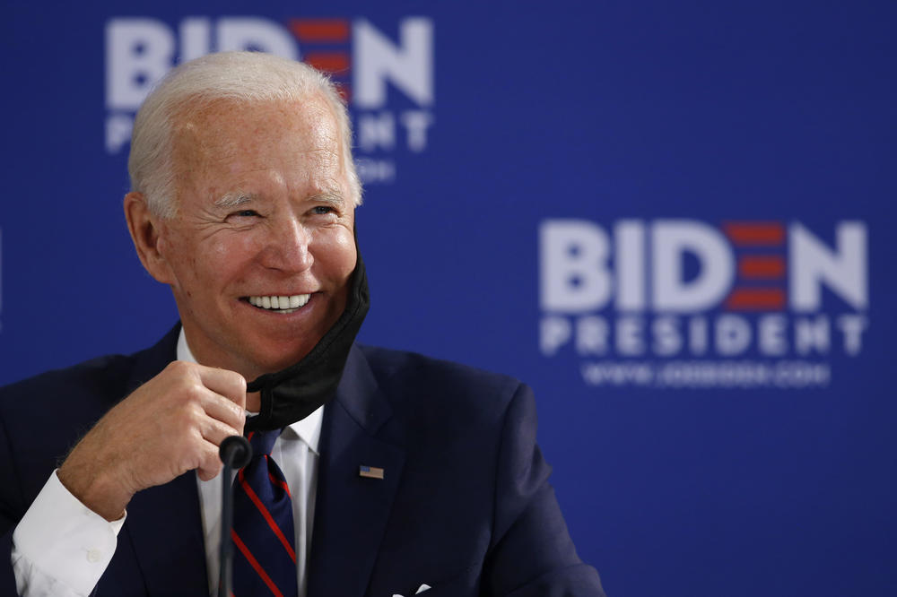 Democratic presidential candidate former Vice President Joe Biden smiles while speaking during a roundtable on economic reopening with community members, Thursday, June 11, 2020, in Philadelphia.