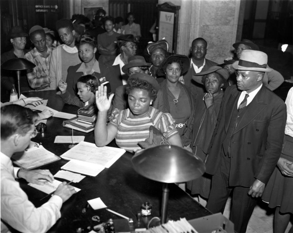 African Americans register to vote in the July 4 Georgia Democratic Primary in Atlanta, Ga., on May 3, 1944. Registrations are increasing in Atlanta as black schools are giving instructions to students in ballot casting procedure. (AP Photo)