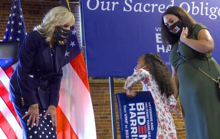 Dr. Jill Biden, left, former second lady and wife of Democratic presidential nominee Joe Biden, meets with Courtney Driver, 33, a United States Marine Corps veteran and vice chair of veterans and military family caucus for the Democratic Party of Georgia, and Driver’s daughter Jaya King, 4. Biden made a campaign stop Monday at Warehouse 9 Restaurant, 920 9th St, in Columbus, Georgia. Biden met with military families and veterans after making brief remarks at the event. 