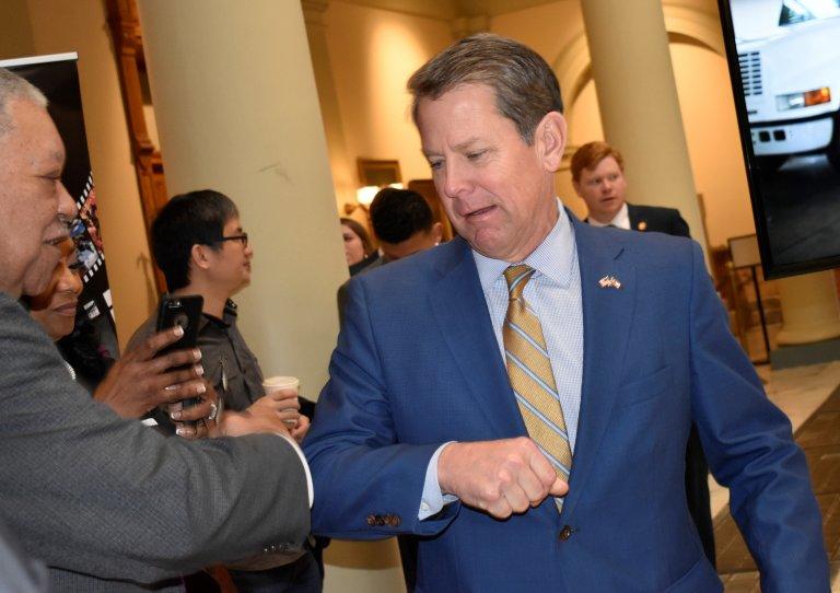 Gov. Brian Kemp greeted friends with an elbow bump at a March celebration of the Georgia film industry at the Capitol days before COVID-19 wreaked havoc on Georgia businesses, including film studios.