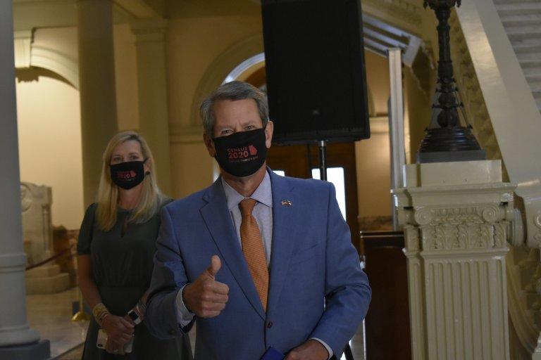 Gov. Brian Kemp and first lady Marty Kemp enter the Capitol with 2020 Census face masks. The Kemps donned the mask last month before rallying Georgians to fill out their census forms. 