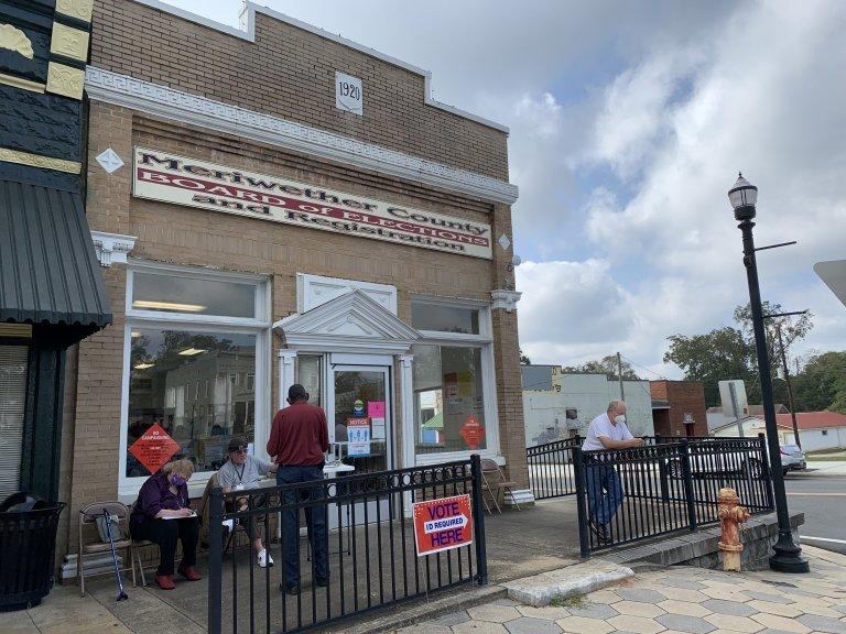 A voter signs in to cast a ballot at Meriwether County's lone early voting location in downtown Greenville. The top Democrat in the Georgia House is defending his seat representing a district about an hour south of Atlanta against a big-spending campaign waged by state and national Republicans.