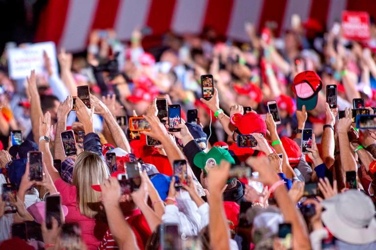 President Donald Trump arrives to his Make America Great Again campaign rally cheer before his arrival at the Middle Georgia Regional Airport in Macon.