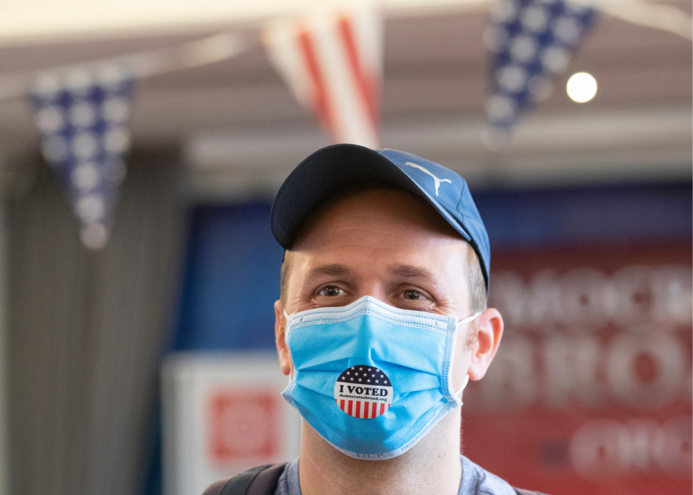 Elliott Zaagman from Michigan wears his mask after casting his vote.