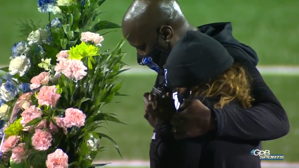 A wreath is placed on field to honor late principal Jamar RobinsonA 