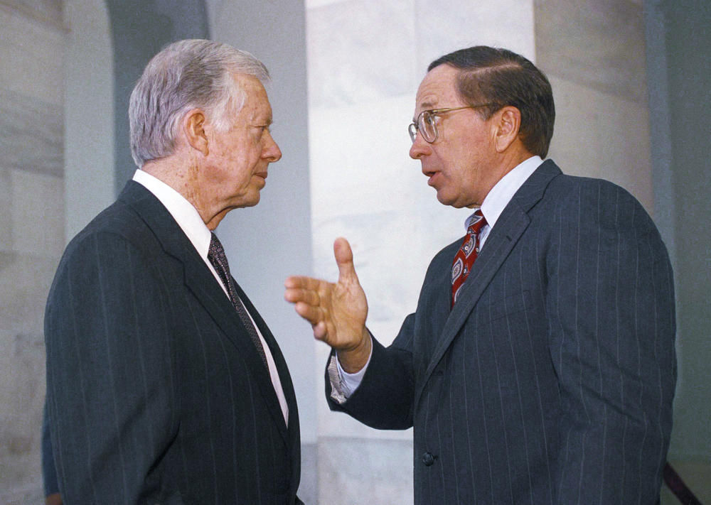 Sen. Sam Nunn (D-Ga.), right, gestures while talking to former President Jimmy Carter on Capitol Hill in Washington, March 31, 1992.