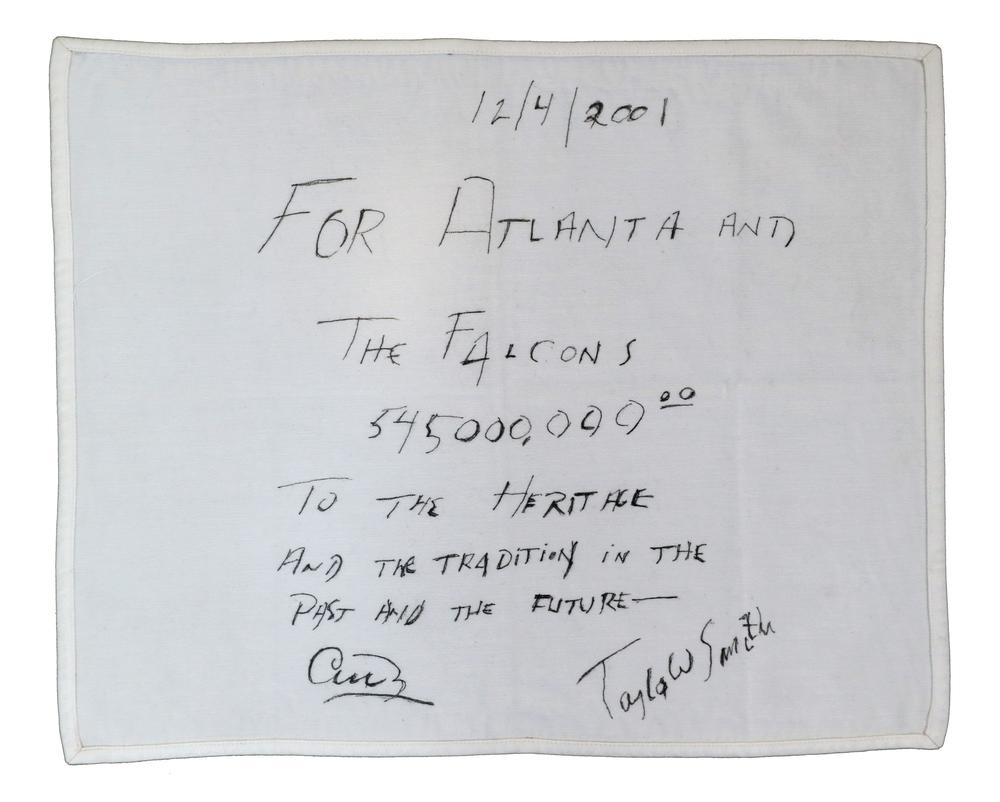 Pictured is the famous “napkin deal” that sealed Arthur Blank’s agreement with Taylor Smith to purchase the Atlanta Falcons for $545 million in 2001.   Photo credit: Kara Durette/AMBSE Creative