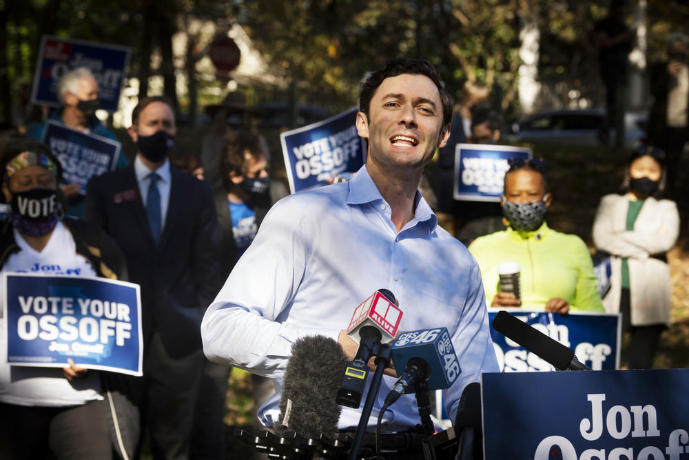 Georgia Democratic candidate for U.S. Senate Jon Ossoff speaks to the media as he rallies supporters for a run-off against Republican candidate Sen. David Perdue, as they meet in Grant Park, Friday, Nov. 6, 2020, in Atlanta.