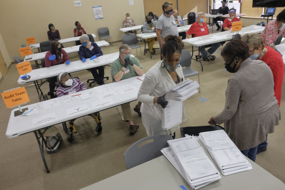 Absentee ballots are unpacked for audit in Macon.