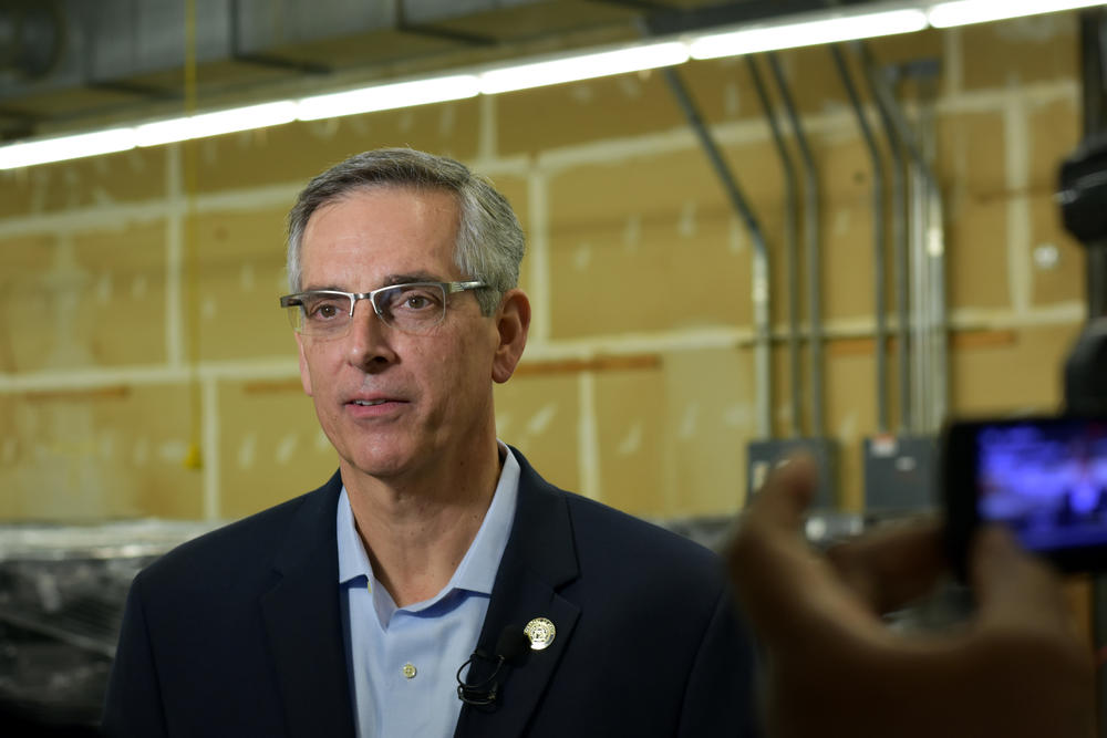 Republican Secretary of State Brad Raffensperger gives an interview inside a voting machine warehouse Dec. 2019.