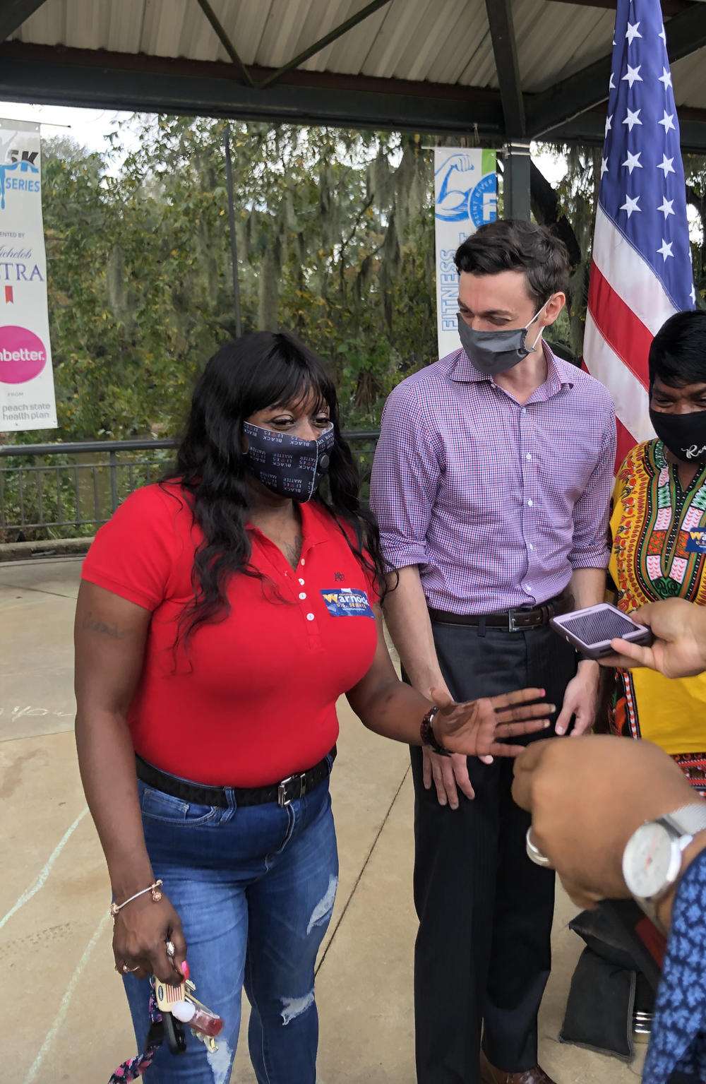 Jon Ossoff supporter Cassandra Dennard, left, stands with Ossoff during the U.S. Senate candidate's visit to Albany, Georgia, in 2020.