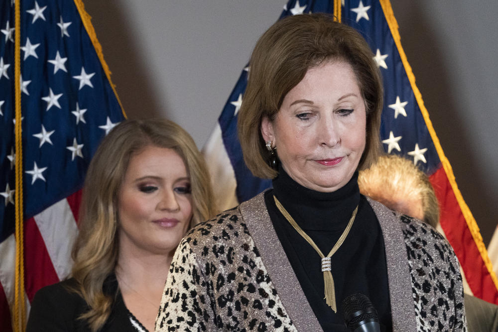 Members of President Donald Trump's legal team, Sidney Powell, right, with Jenna Ellis, left, attend a news conference at the Republican National Committee headquarters, Thursday Nov. 19, 2020, in Washington.