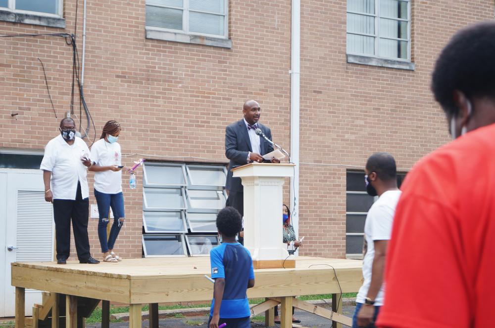 Mawuli Davis addresses a crowd at a vigil for Secoriea Turner in August.