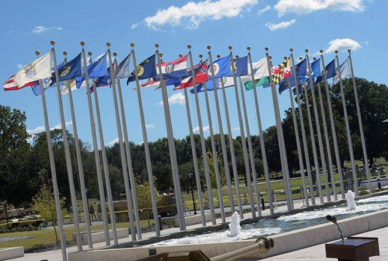 Flags fly at Fort Benning (Mississippi's former banner is red in center) in 2014 during a special screening of the movie "Fury" filmed at the Army base near Columbus. Lawmakers in Washington are calling for the renaming of Fort Benning, Fort Gordon near Augusta and other military bases named for Confederates. 