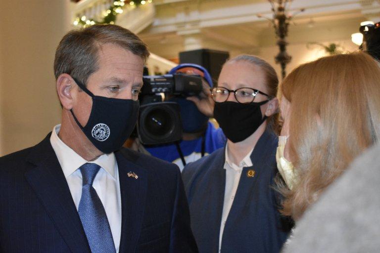 Gayle Troyer of Forsyth County asks Gov. Brian Kemp to call the Legislature into special session in the Georgia Capitol Tuesday. 