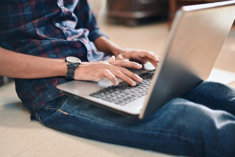 Teenager using laptop
