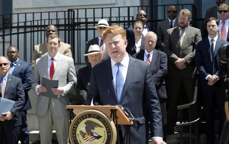 United States Attorney Charles E. Peeler, (center), speaks at a press conference in 2018. Peeler announced Wednesday he intends to resign from his position as Middle Georgia’s top federal prosecutor.