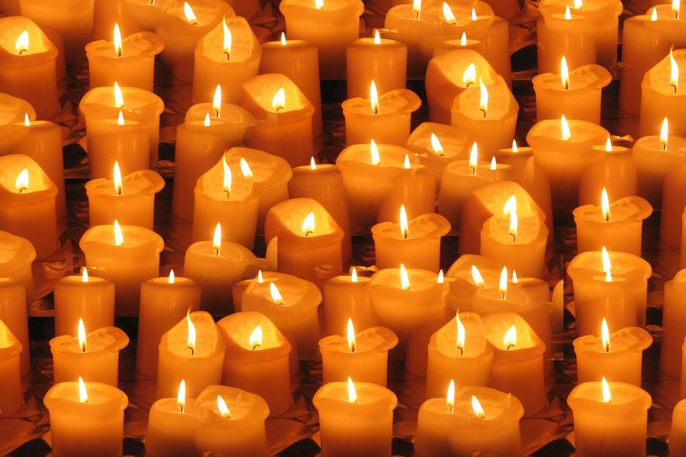 Rows of lit candles.