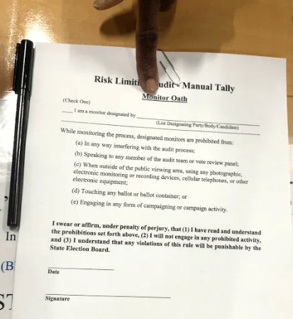 In Chatham County, poll watchers and nonpartisan monitors were asked to read and to sign an oath to view the count process.