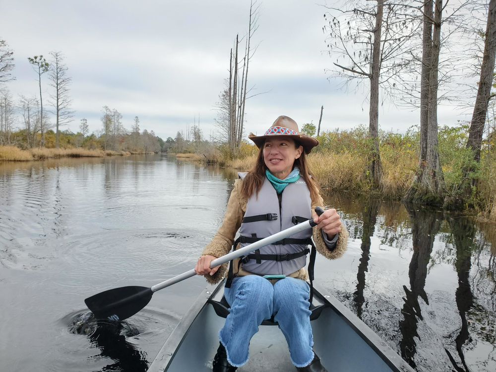 Rena Peck paddles a canoe in the Okefenokee swamp