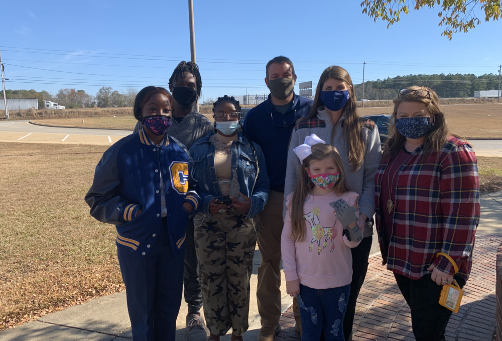 Students and teacher with prosthetic 