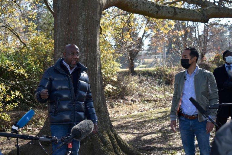 Rev. Raphael Warnock pitches to voters with former HUD Secretary Julian Castro at East Lake Park in Atlanta. Young and Latino Georgians could be decisive in the Jan. 5 Senate runoffs.