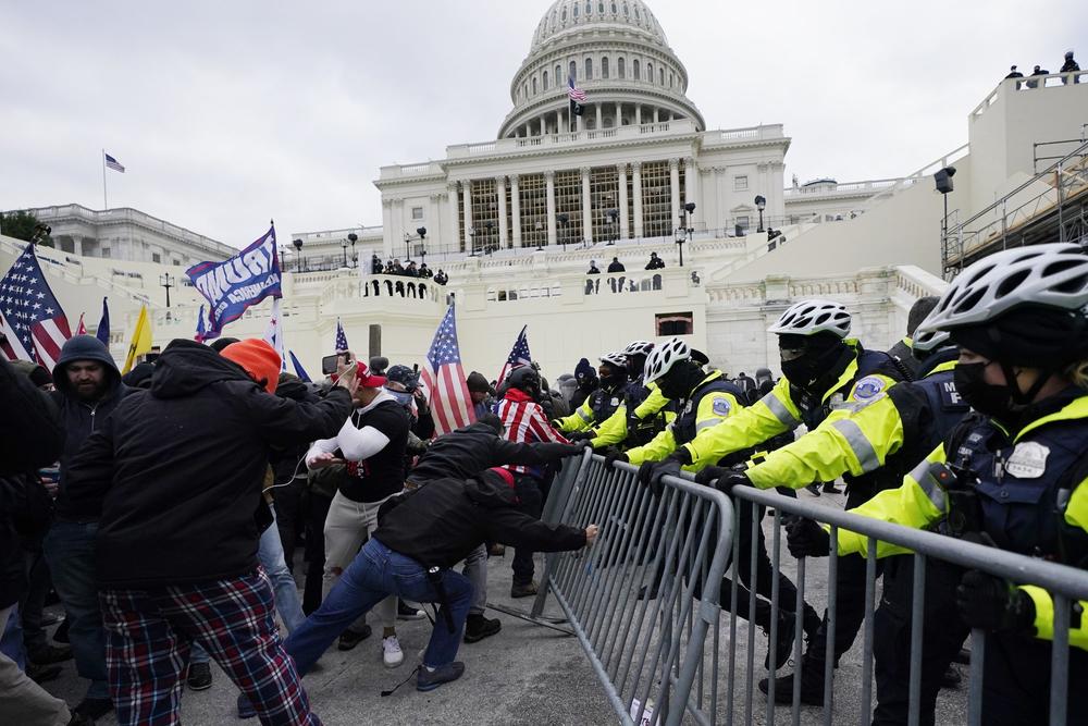 Protesters fight police outside the Capitol in Washington, D.C.