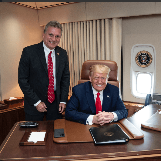 U.S. Rep. Earl L. “Buddy” Carter stands on Air Force One with President Donald J. Trump.