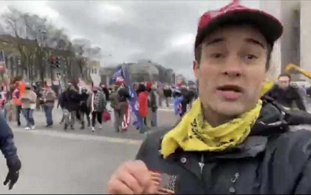 During the march to the U.S. Capitol, Dominic Box appears onscreen as he narrates a video livestreamed through the Savannah Freedom Alliance Facebook group.