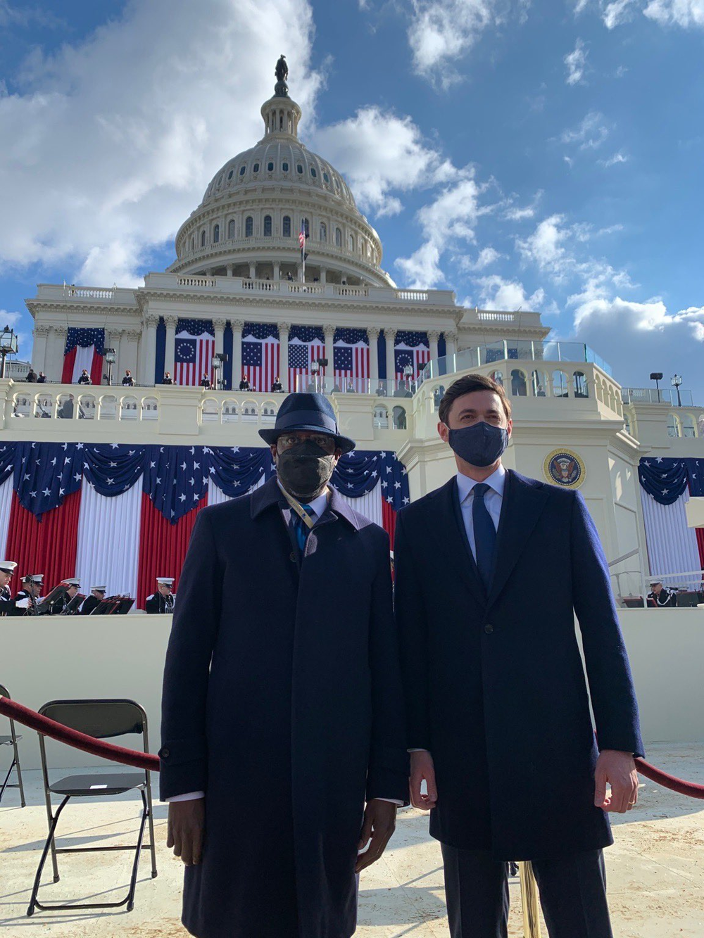 Sens. Raphael Warnock and Jon Ossoff pose in front of the U.S. Capitol before the inauguration of President Joe Biden.