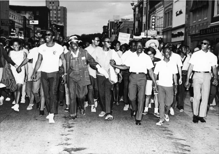  Civil rights marcher walk down Cherry Street in Macon in 1968.