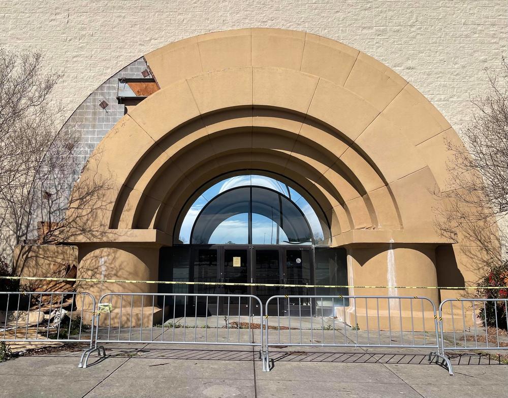 The edifice crumbles on the entrance to Town Center's former Sears location.