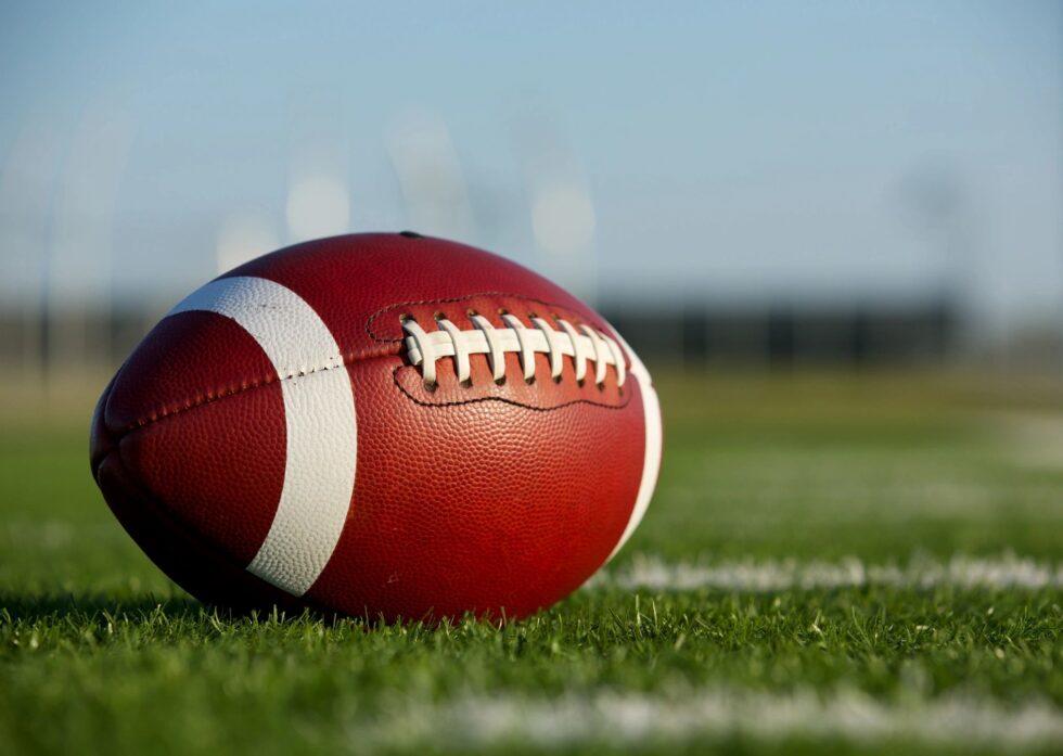 Football sitting on field