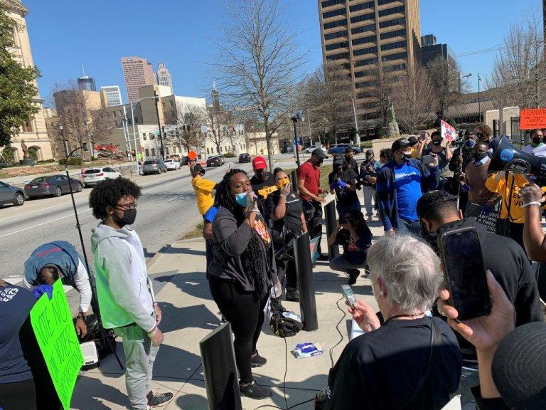 A group of protesters assembled outside the state Capitol Thursday to decry GOP legislation they say are a step backwards for voting rights that feed the false narrative that something was amiss in the 2020 election.