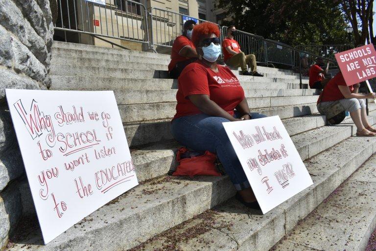 Cobb County teacher Chantae Pittman took part in a school reopening protest at the Capitol in July. She's relieved Georgia expanded vaccine eligibility to include teachers, but she already made an appointment in Alabama. 