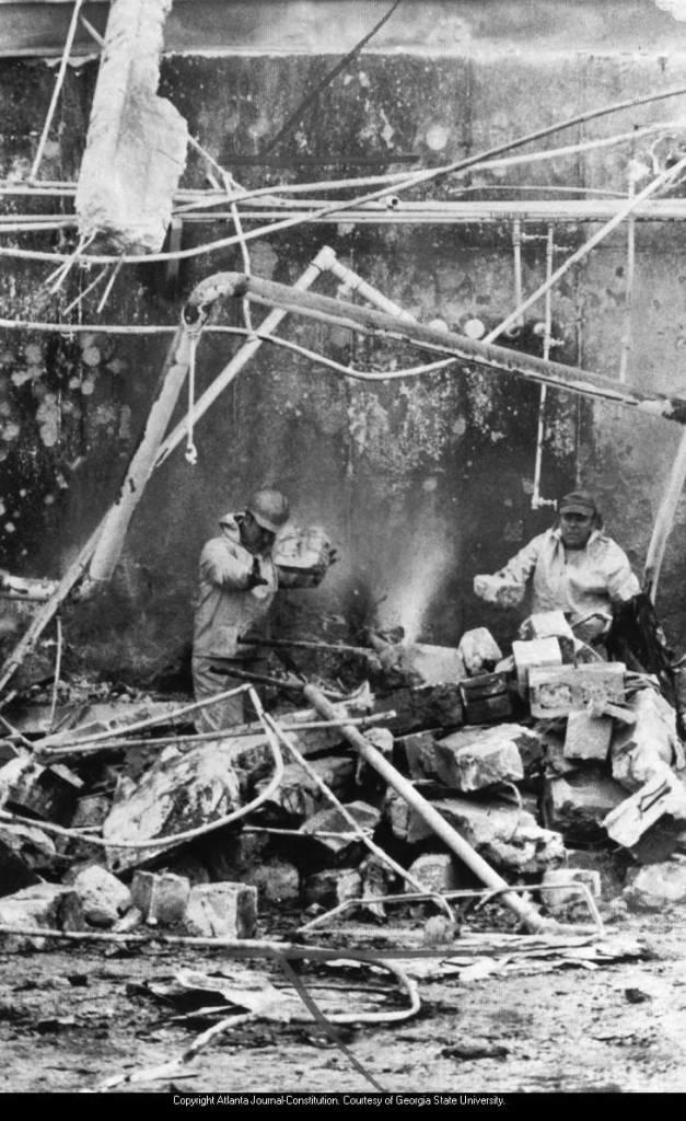 Fireman search for bodies in twisted wreckage of the Thiokol plant in Woodbine on Feb. 4, 1971. 