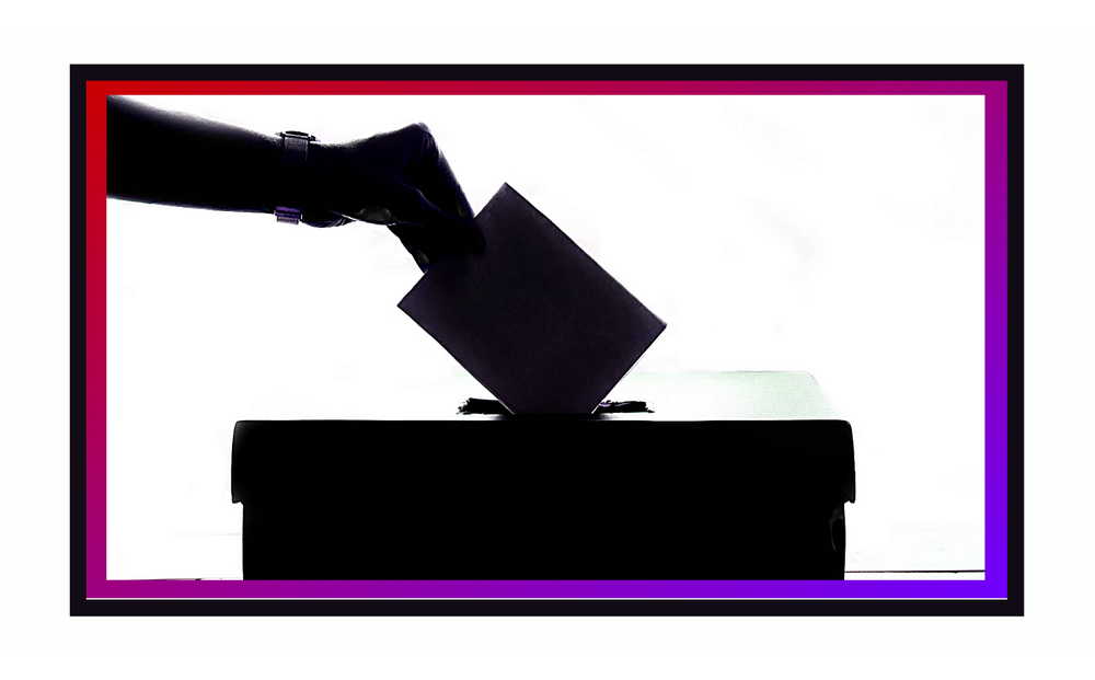 An illustration of a hand dropping a ballot into a ballot box.