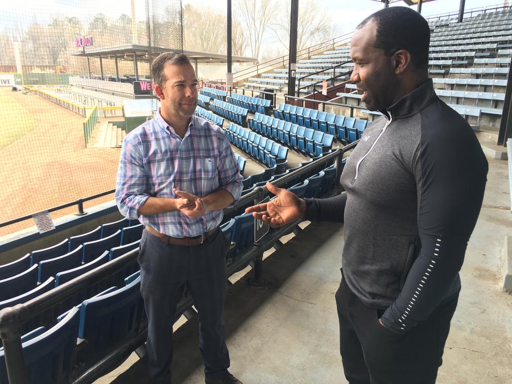 Actor Bradford Haynes talks with Macon Bacon president Brandon Raphael about a locker room scene for the film “unDefiled” to be shot at Luther Williams Field. 