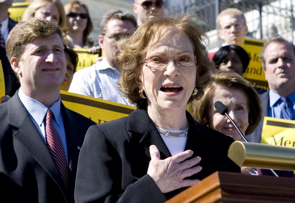 In this March 5, 2008 file photo, former first lady Rosalynn Carter, center, flanked by Rep. Patrick Kennedy, D-R.I., left, and House Speaker Nancy Pelosi of Calif., right, participates in rally on the Capitol Hill in Washington to discuss bipartisan mental health parity legislation.
